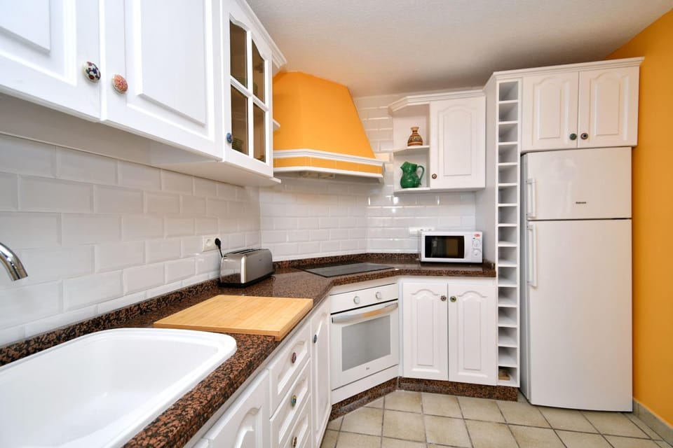 Kitchen or kitchenette, dishwasher, oven, stove
