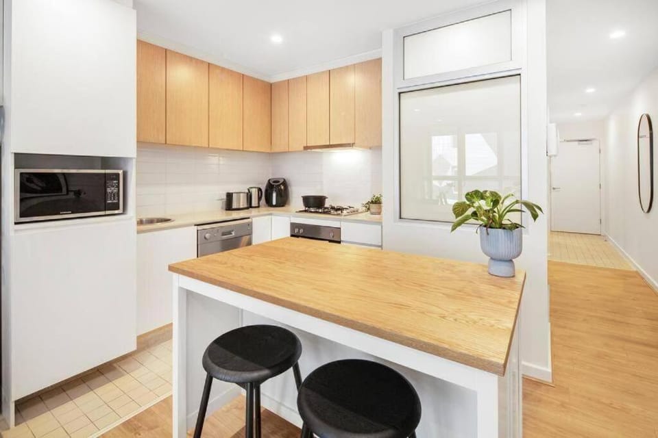 Kitchen or kitchenette, dishwasher, oven, stove