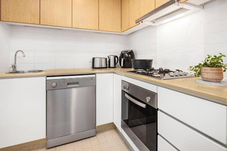 Kitchen or kitchenette, dishwasher, oven, stove