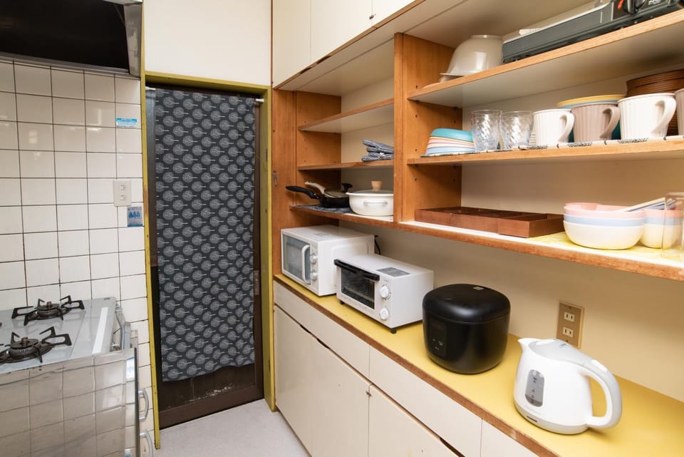 Kitchen or kitchenette, stove, toaster