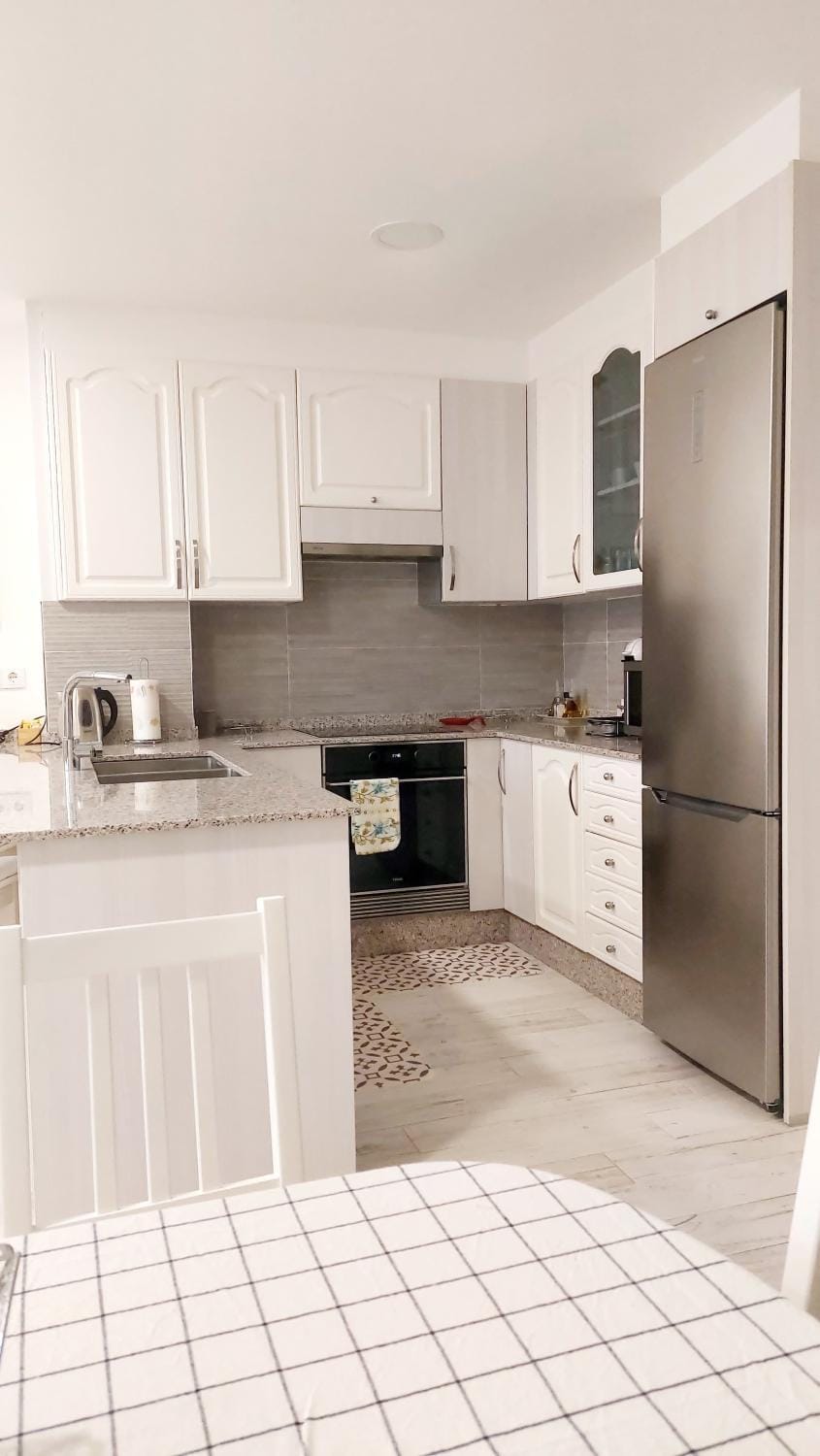 Kitchen or kitchenette, dishwasher, oven, stove