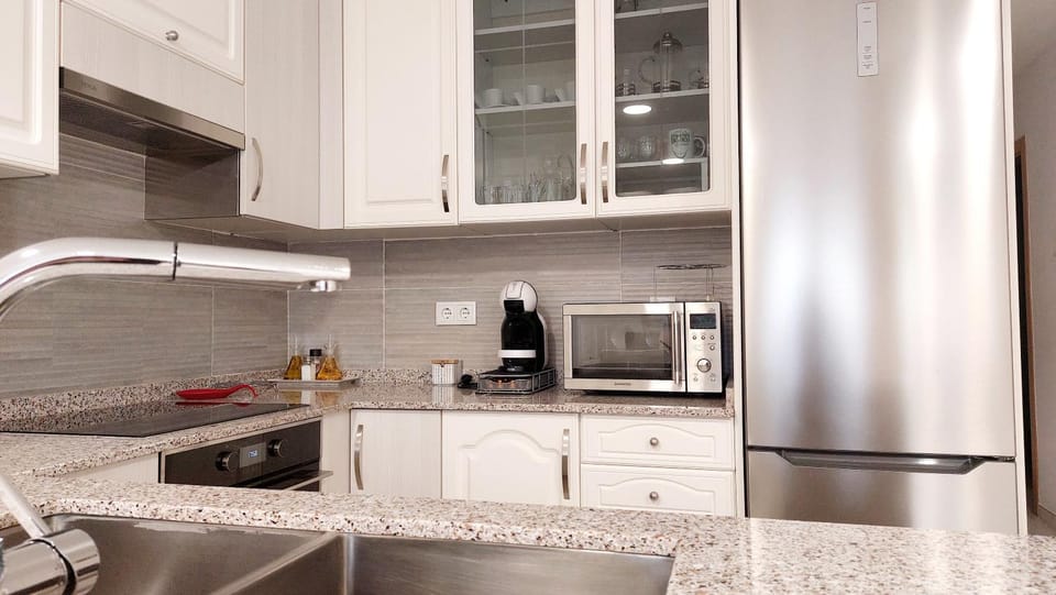 Kitchen or kitchenette, dishwasher, oven, stove, toaster