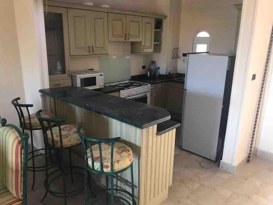Kitchen or kitchenette, dishwasher, oven, stove, toaster
