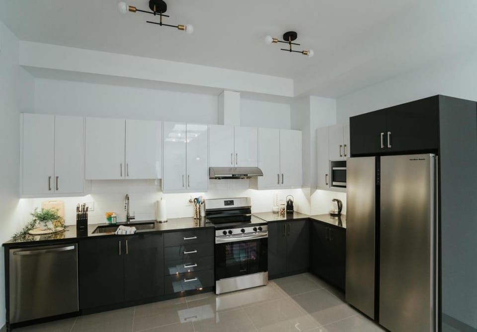 Kitchen or kitchenette, dishwasher, oven, stove