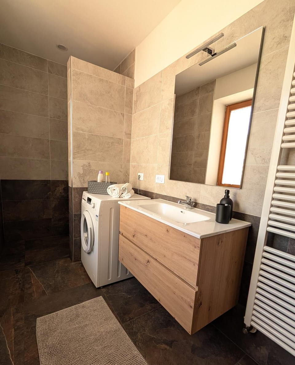 Shower, Bathroom, hair dryier, towels, washing machine