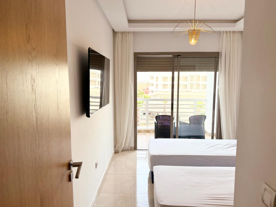 Douce escale vue sur piscine - Costa Beach bouznika Apartment in Casablanca-Settat