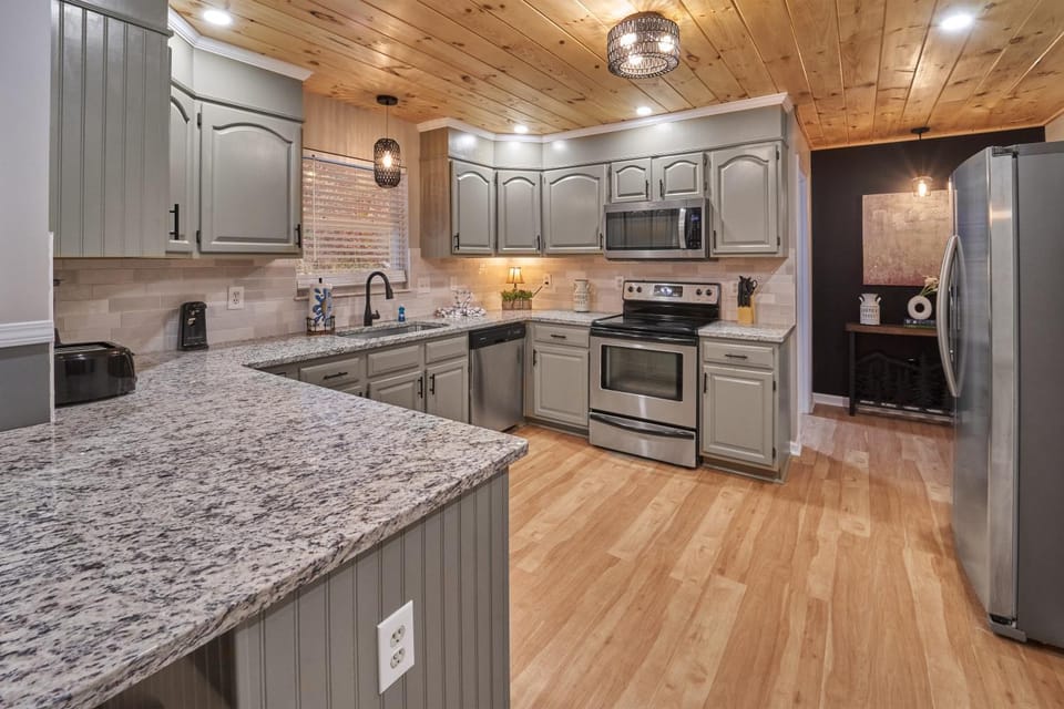 Kitchen or kitchenette, dishwasher, oven, stove, toaster