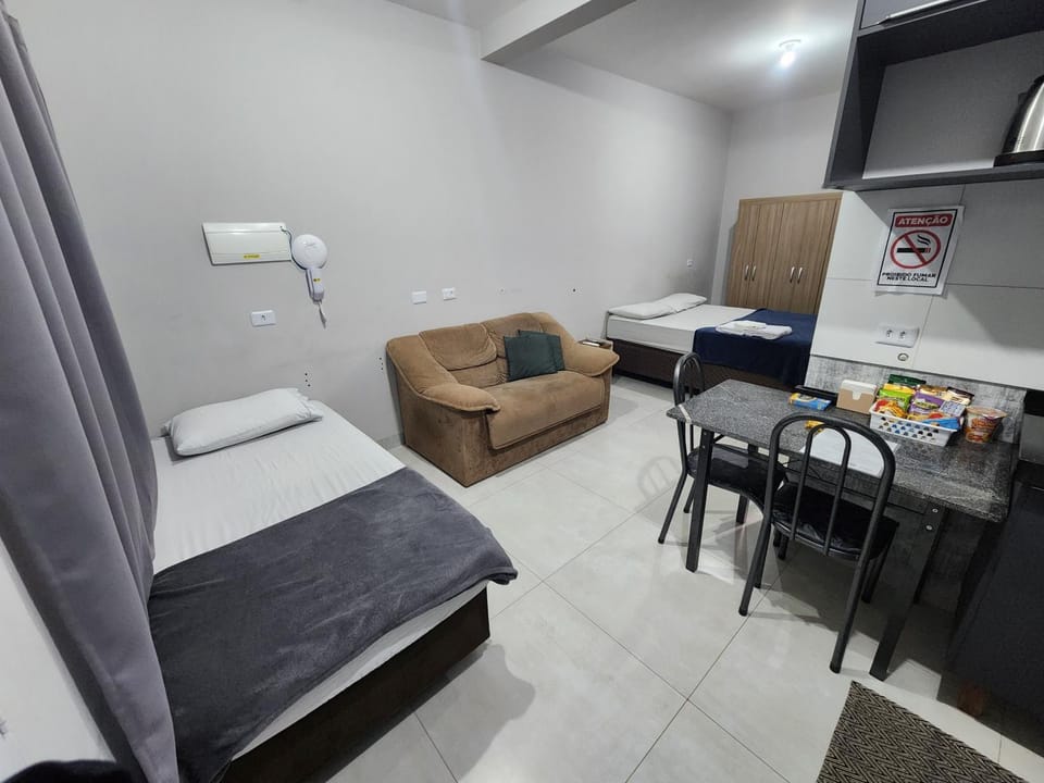 TV and multimedia, Kitchen or kitchenette, Living room, Photo of the whole room, Seating area, Dining area, Bedroom