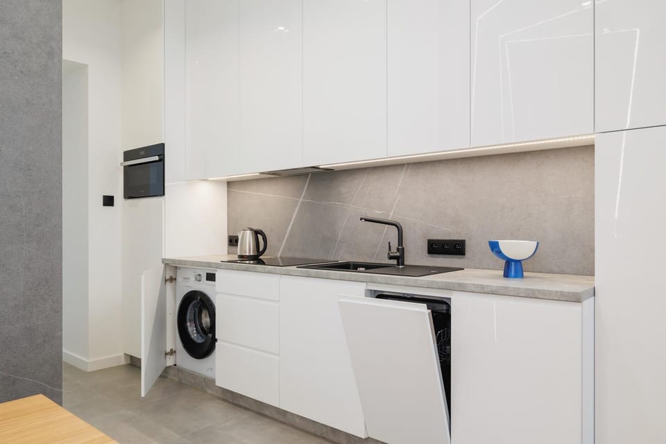 Kitchen or kitchenette, dishwasher, oven, stove, washing machine