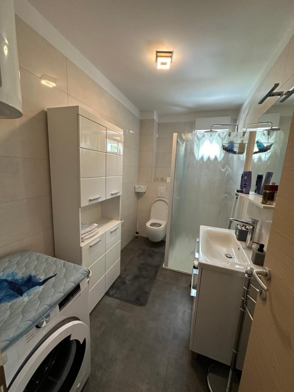 Shower, Toilet, Bathroom, towels, washing machine, dryer