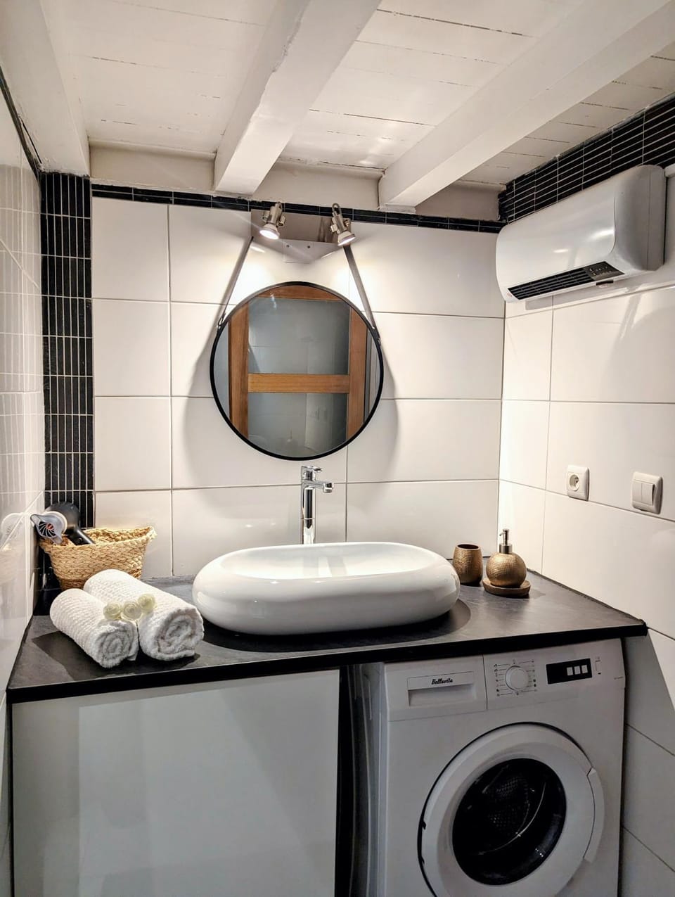 Bathroom, hair dryier, towels, washing machine