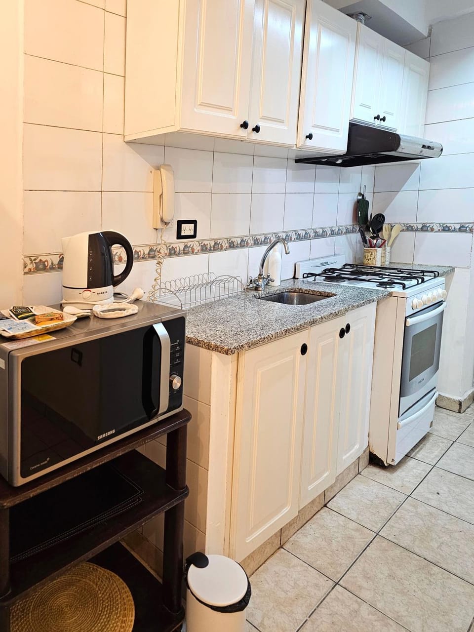 Kitchen or kitchenette, microwave, oven, stove