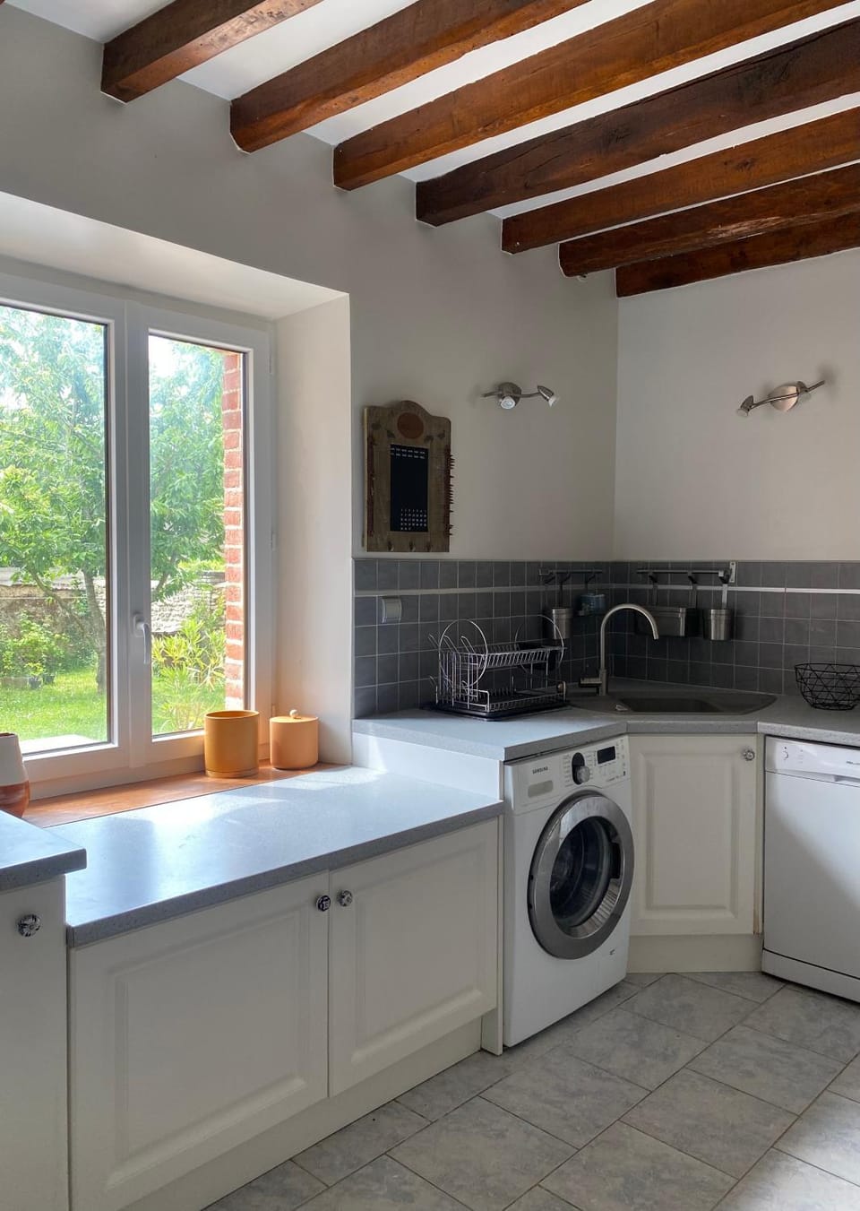 Kitchen or kitchenette, dishwasher, stove, washing machine