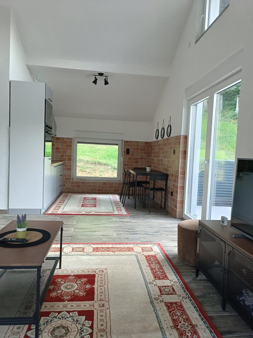 Kitchen or kitchenette, Living room, Seating area, Dining area