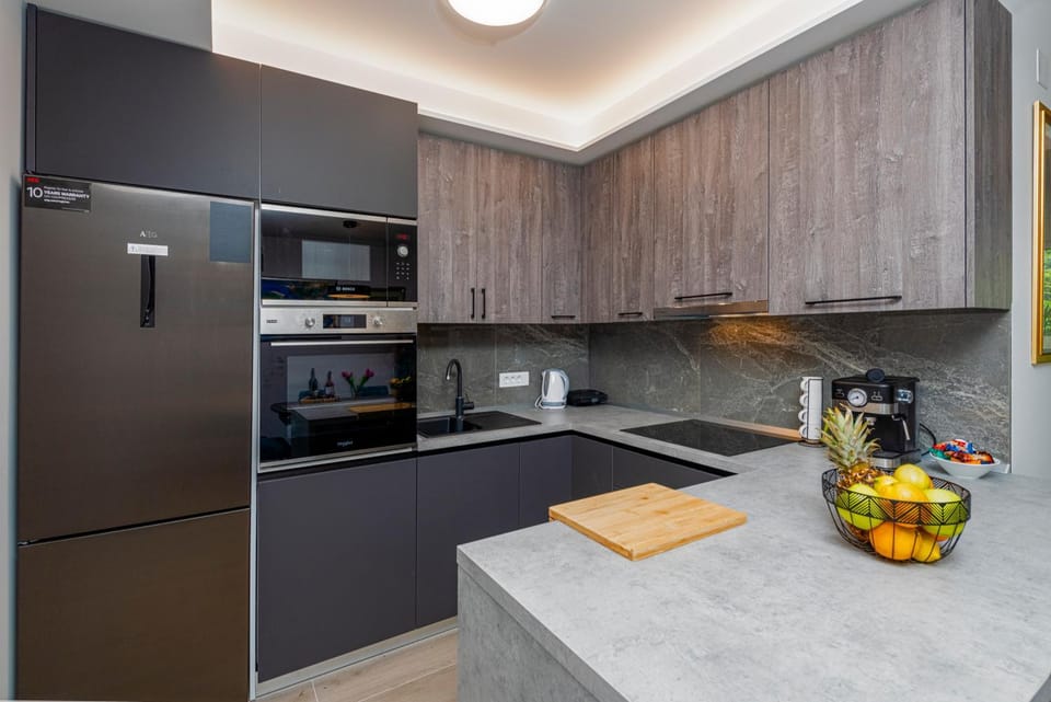 Kitchen or kitchenette, dishwasher, oven, stove, toaster