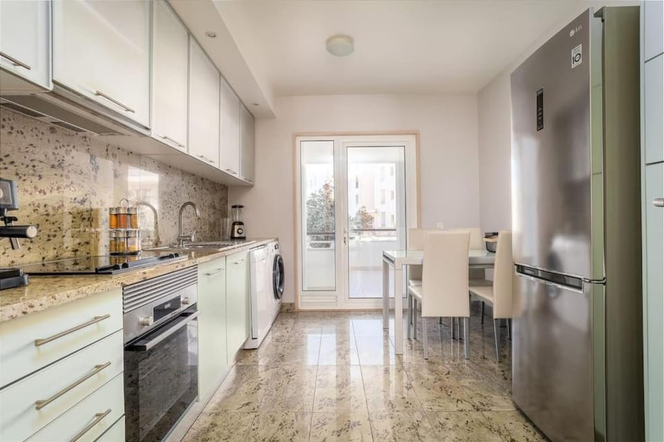 Kitchen or kitchenette, dishwasher, oven, stove