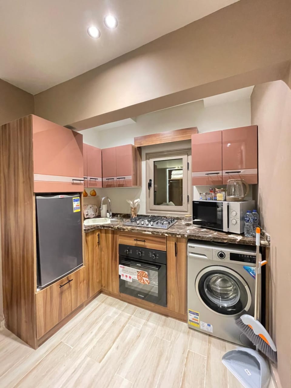 Kitchen or kitchenette, oven, stove, washing machine