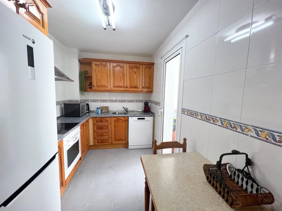 Kitchen or kitchenette, dishwasher, microwave, oven, stove, washing machine