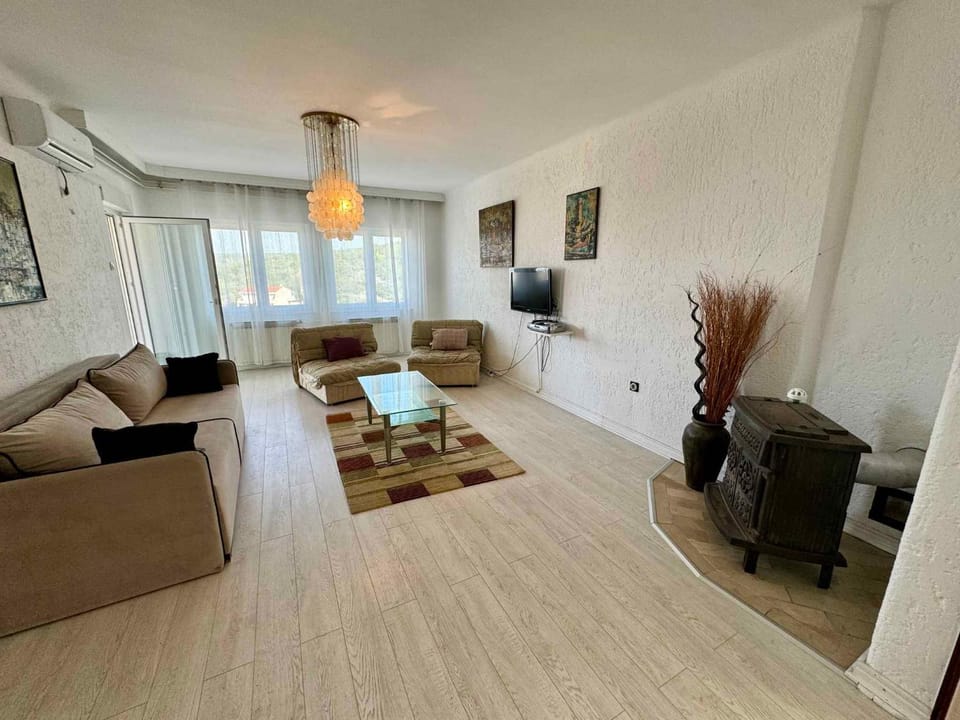 TV and multimedia, Living room, Seating area, fireplace, air conditioner