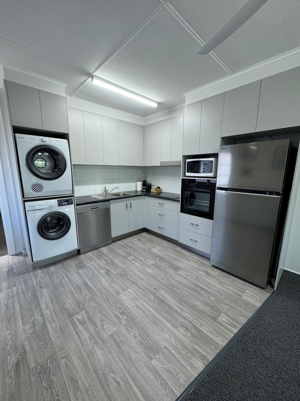 Kitchen or kitchenette, dishwasher, oven, stove, washing machine, dryer
