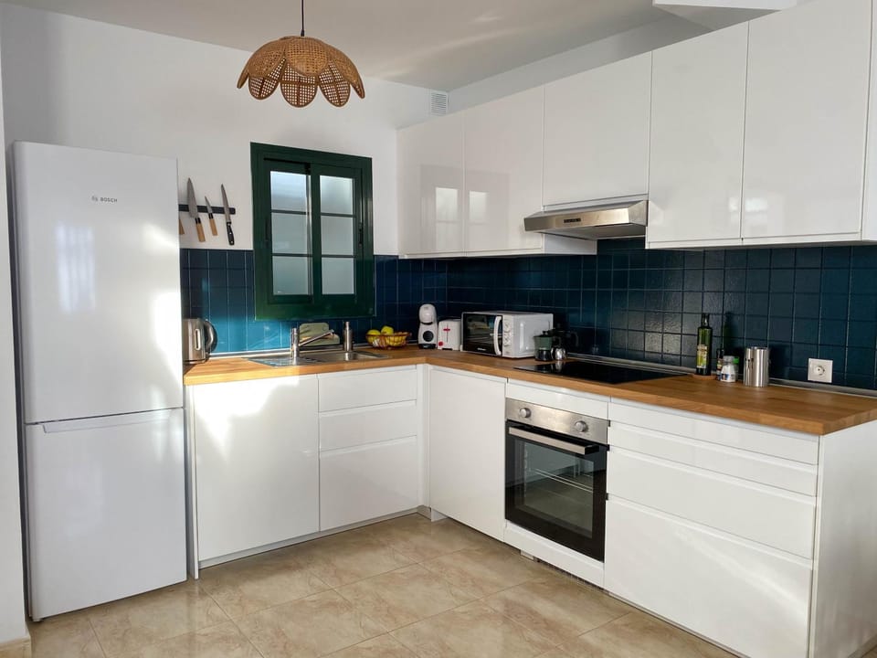 Kitchen or kitchenette, dishwasher, oven, stove, toaster