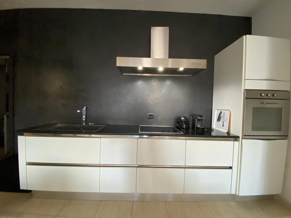 Kitchen or kitchenette, dishwasher, oven, stove