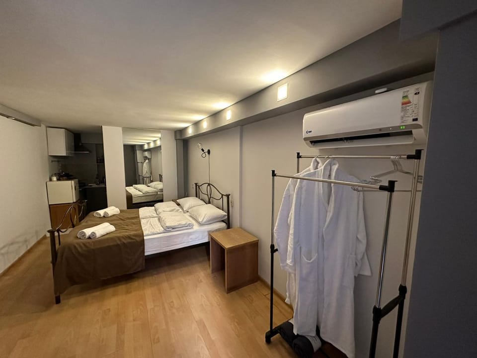 Bed, towels, wardrobe, air conditioner