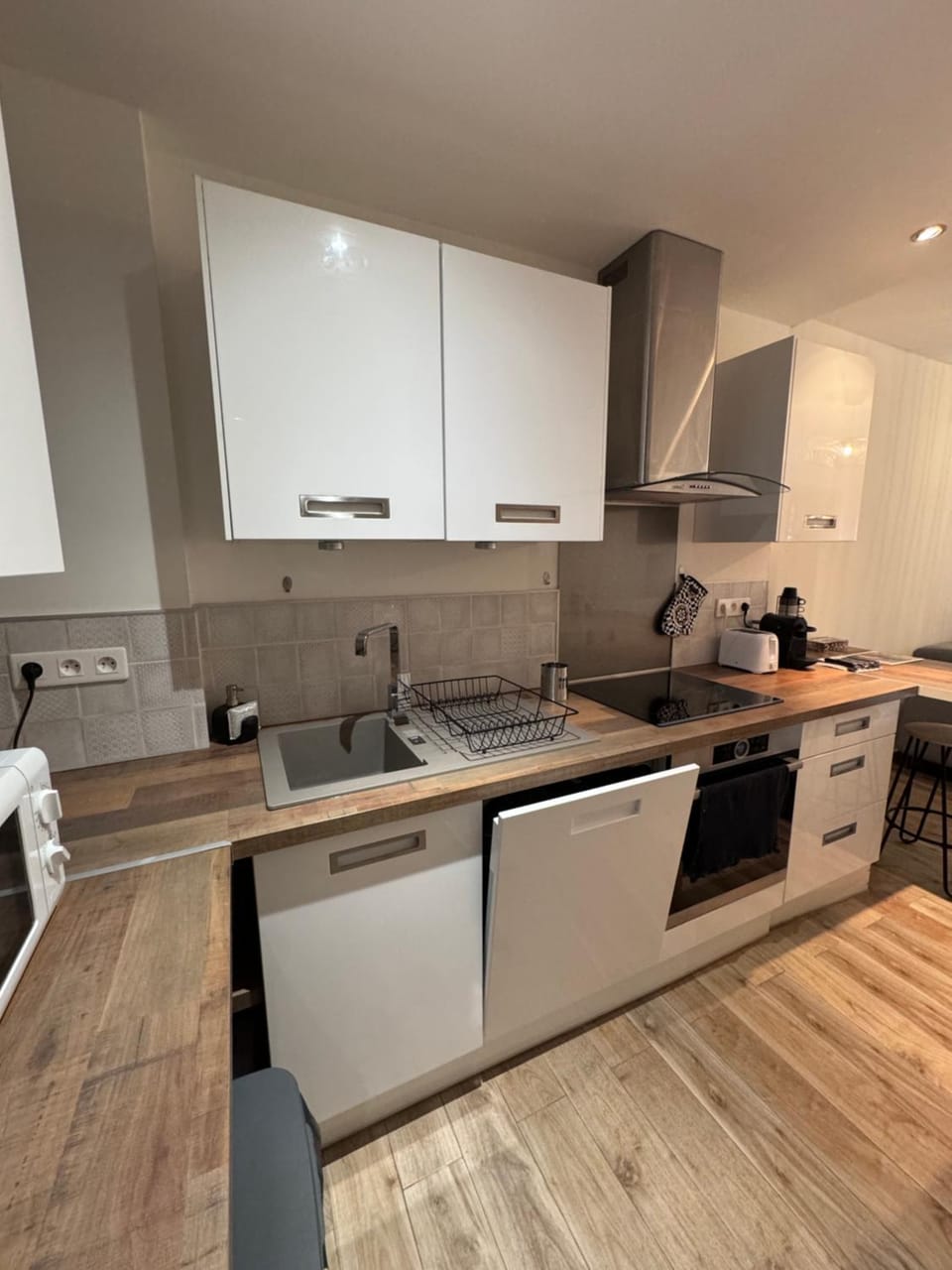 Kitchen or kitchenette, dishwasher, oven, stove, toaster