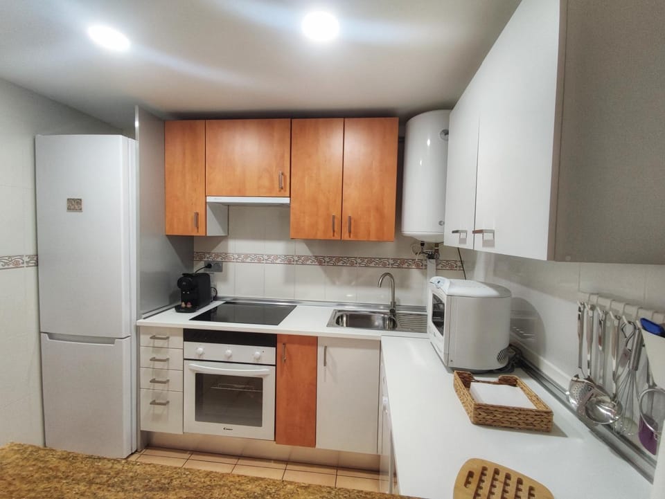 Kitchen or kitchenette, dishwasher, oven, stove