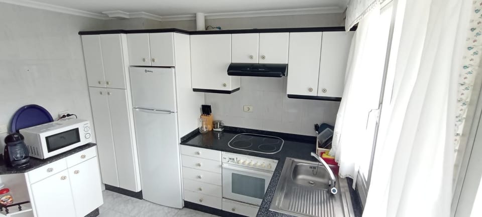 Kitchen or kitchenette, microwave, oven, stove