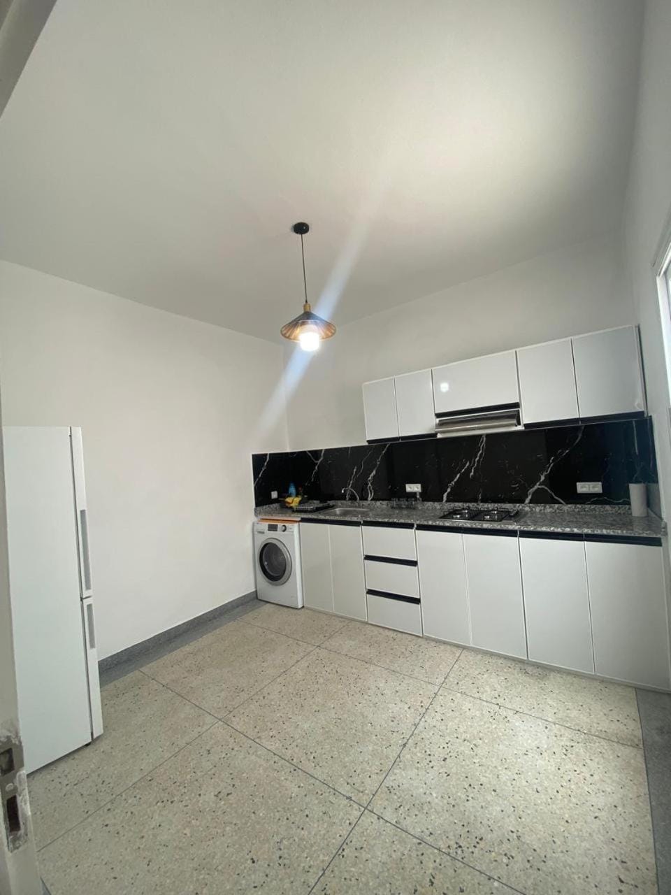 Kitchen or kitchenette, stove, washing machine