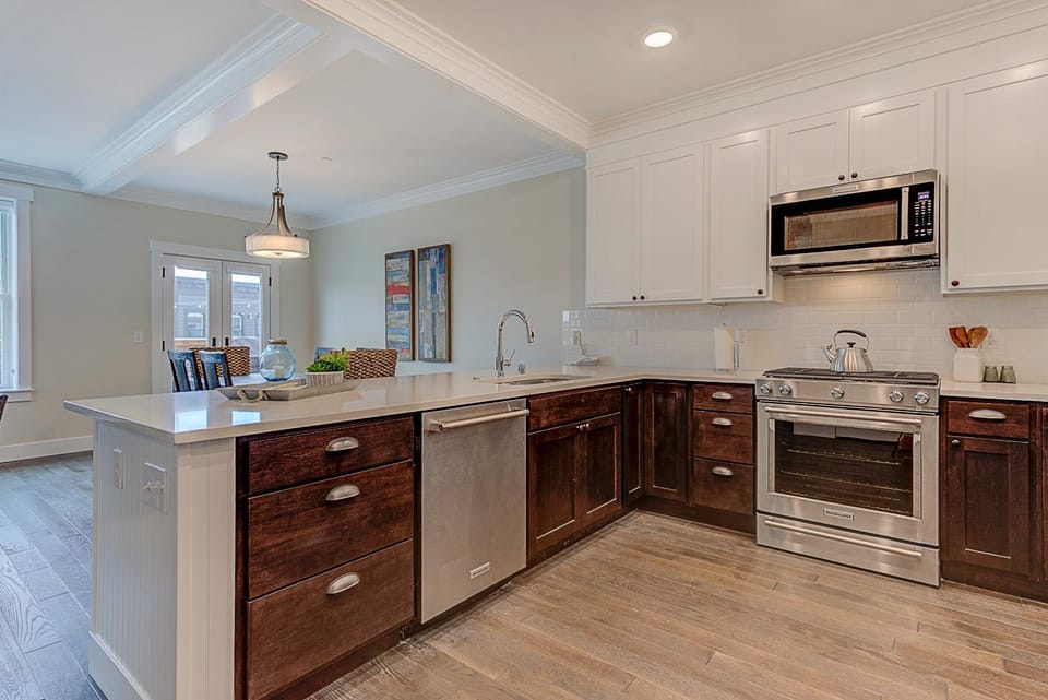 Kitchen or kitchenette, dishwasher, oven, stove