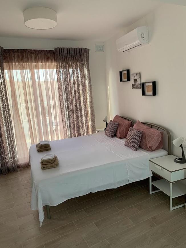 Photo of the whole room, Bedroom, towels, air conditioner
