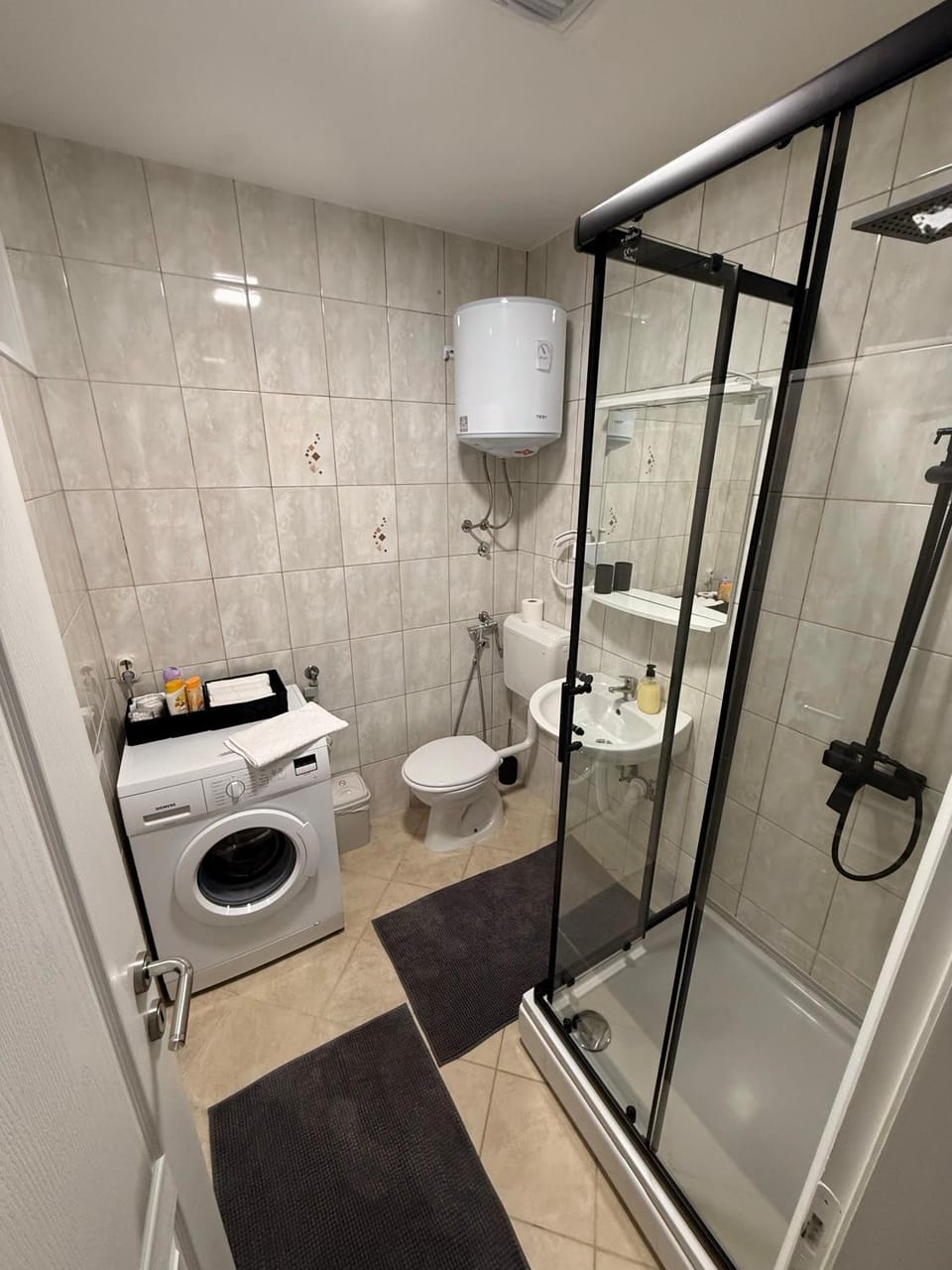 Shower, Toilet, Bathroom, bidet, towels, washing machine, dryer