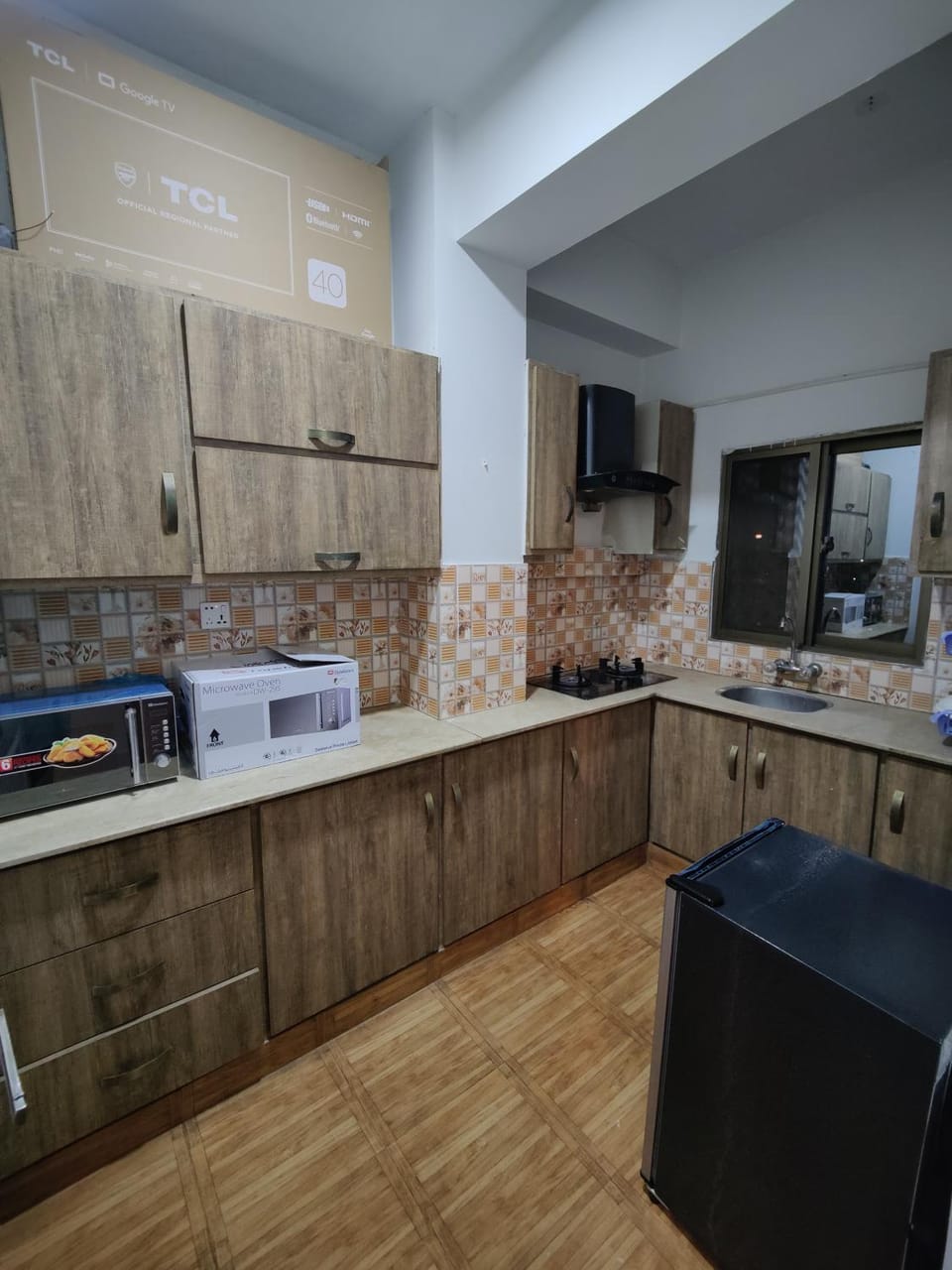 Kitchen or kitchenette, dishwasher, oven, stove