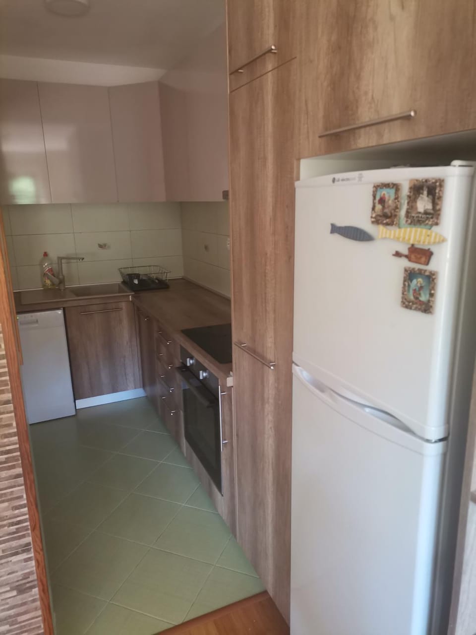 Kitchen or kitchenette, dishwasher, oven, stove