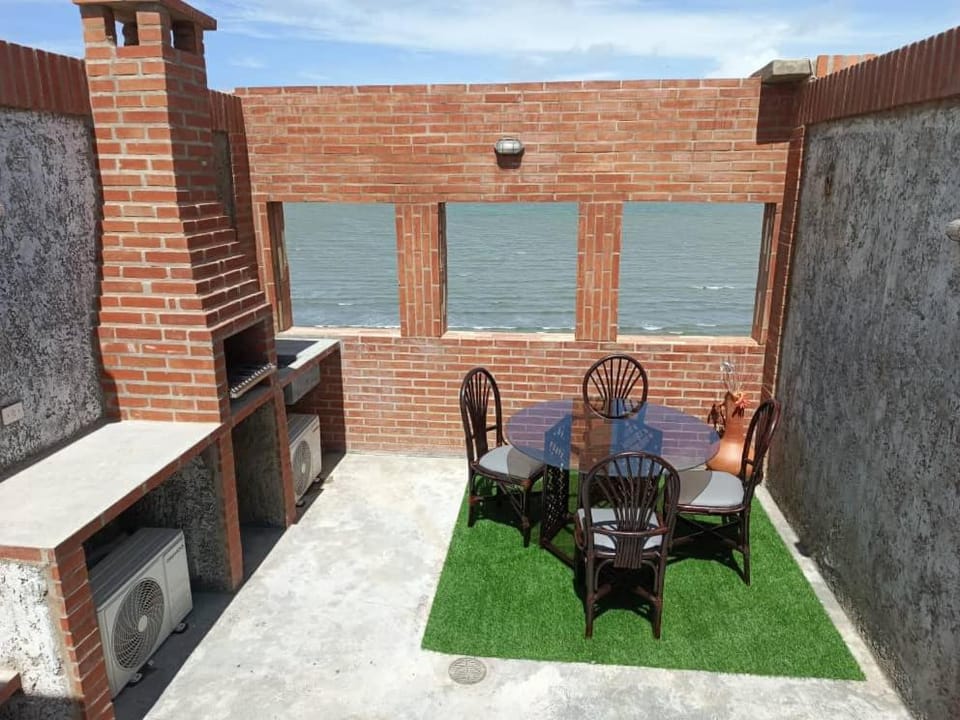 View (from property/room), Balcony/Terrace, Seating area, Beach, Sea view