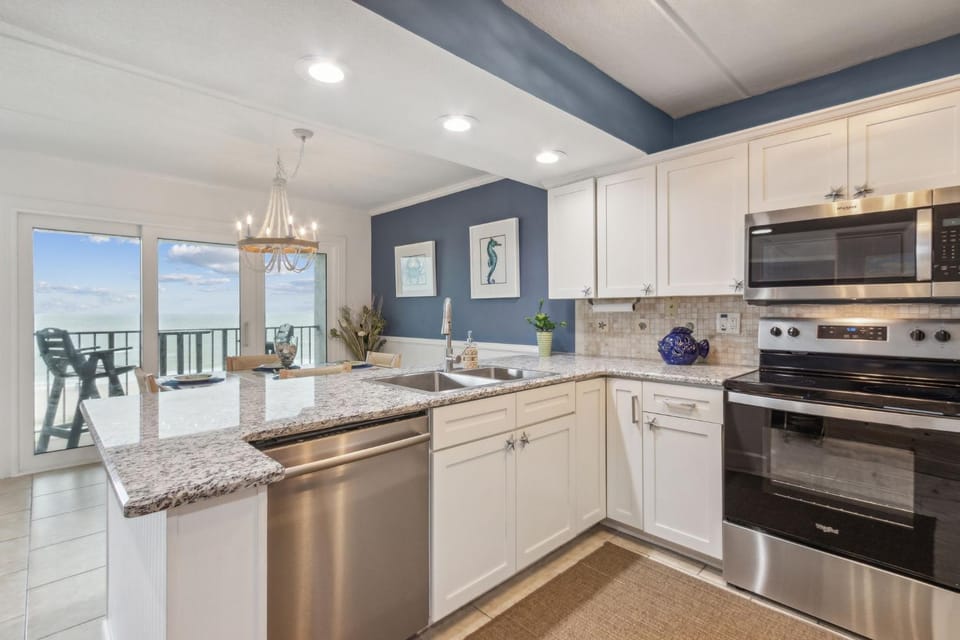 Kitchen or kitchenette, dishwasher, oven, stove