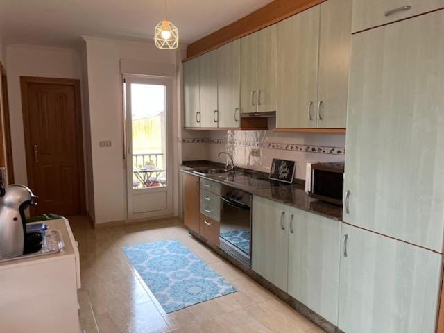 Kitchen or kitchenette, oven, stove, toaster