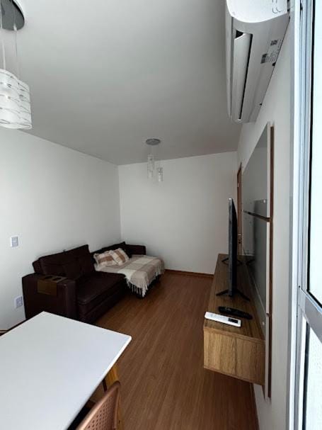 Bed, TV and multimedia, Living room, Seating area, air conditioner