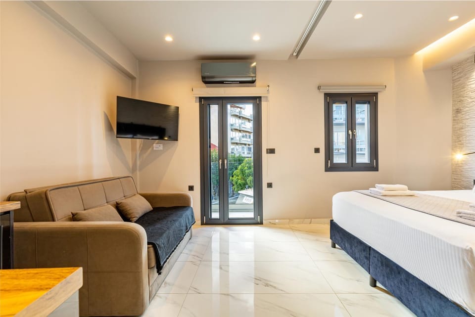 Bed, TV and multimedia, Living room, Seating area, Bedroom, air conditioner