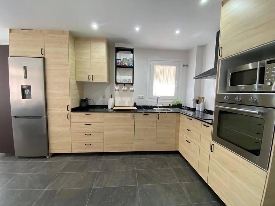 Kitchen or kitchenette, dishwasher, oven, stove, toaster