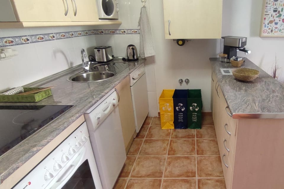 Kitchen or kitchenette, dishwasher, oven, stove