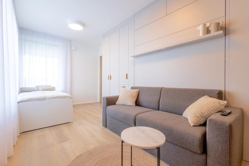 Bed, Living room, Seating area, Bedroom