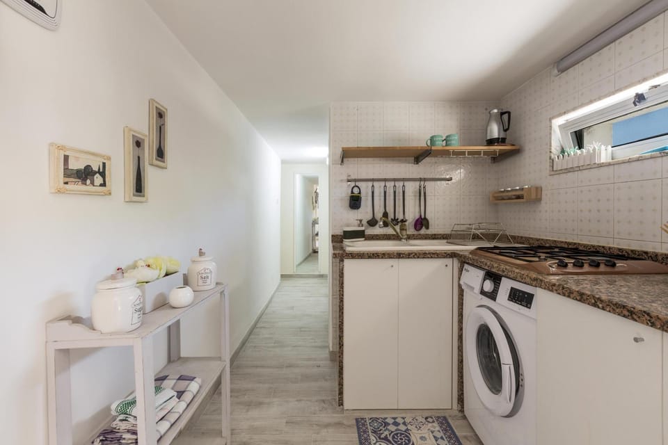 Kitchen or kitchenette, washing machine
