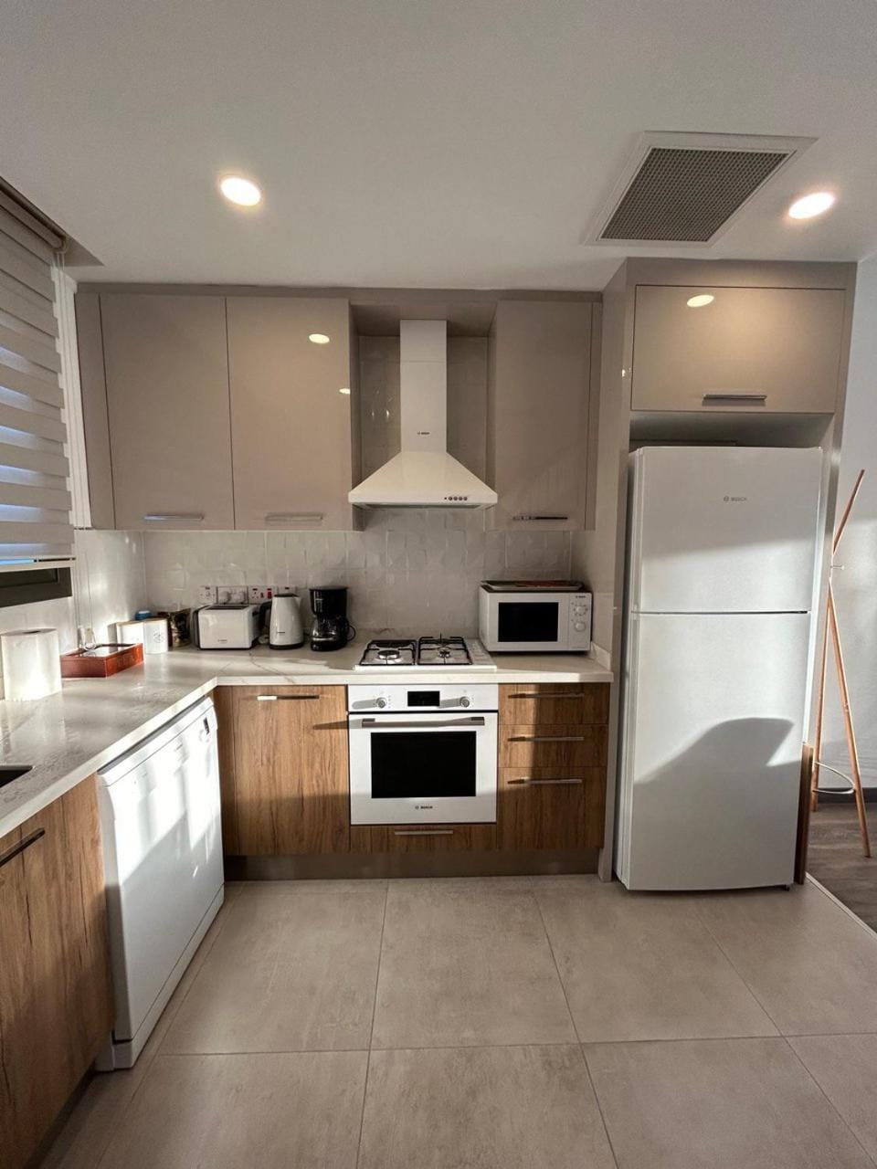 Kitchen or kitchenette, dishwasher, oven, stove, toaster