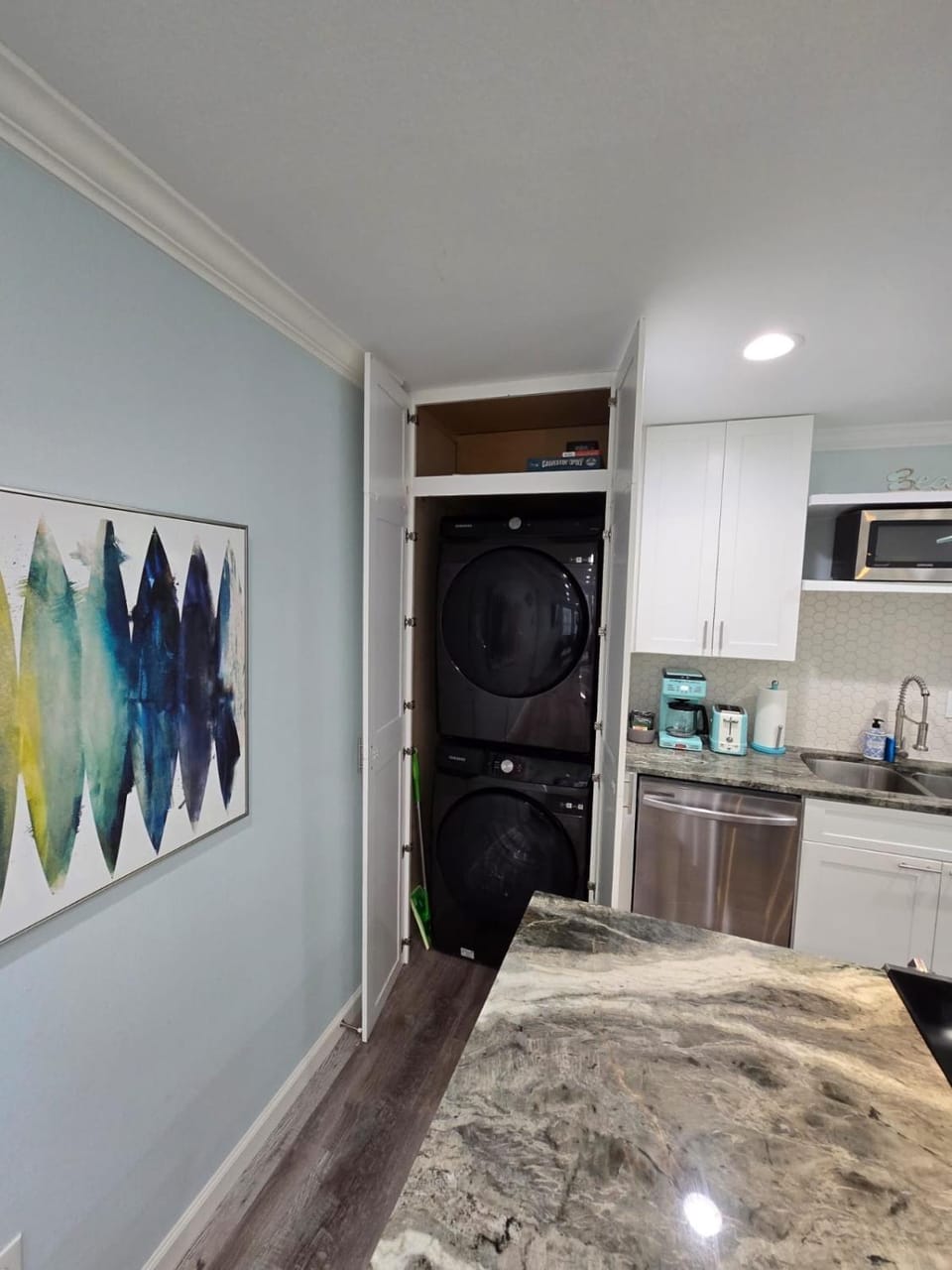 Kitchen or kitchenette, dishwasher, oven, stove, laundry, washing machine, dryer