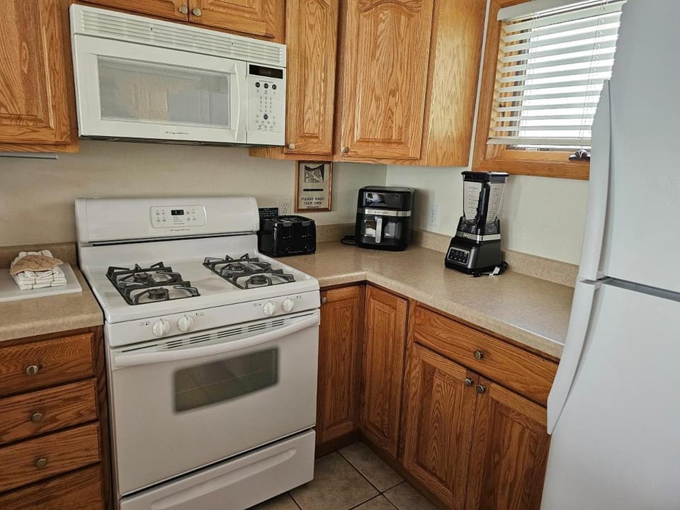Kitchen or kitchenette, dishwasher, stove, toaster