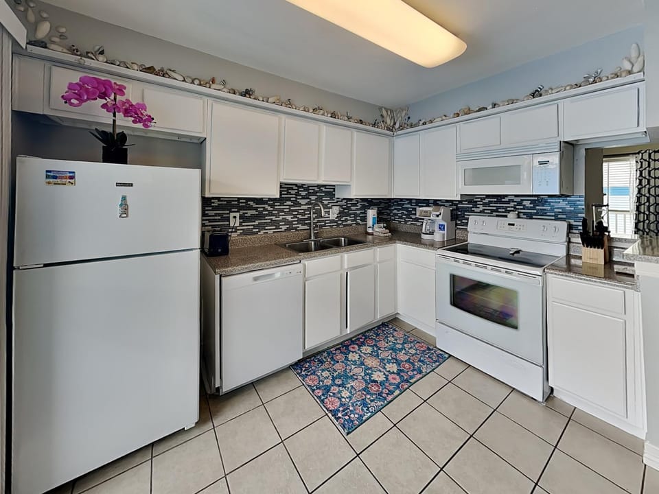 Kitchen or kitchenette, dishwasher, microwave, oven, stove, kitchen