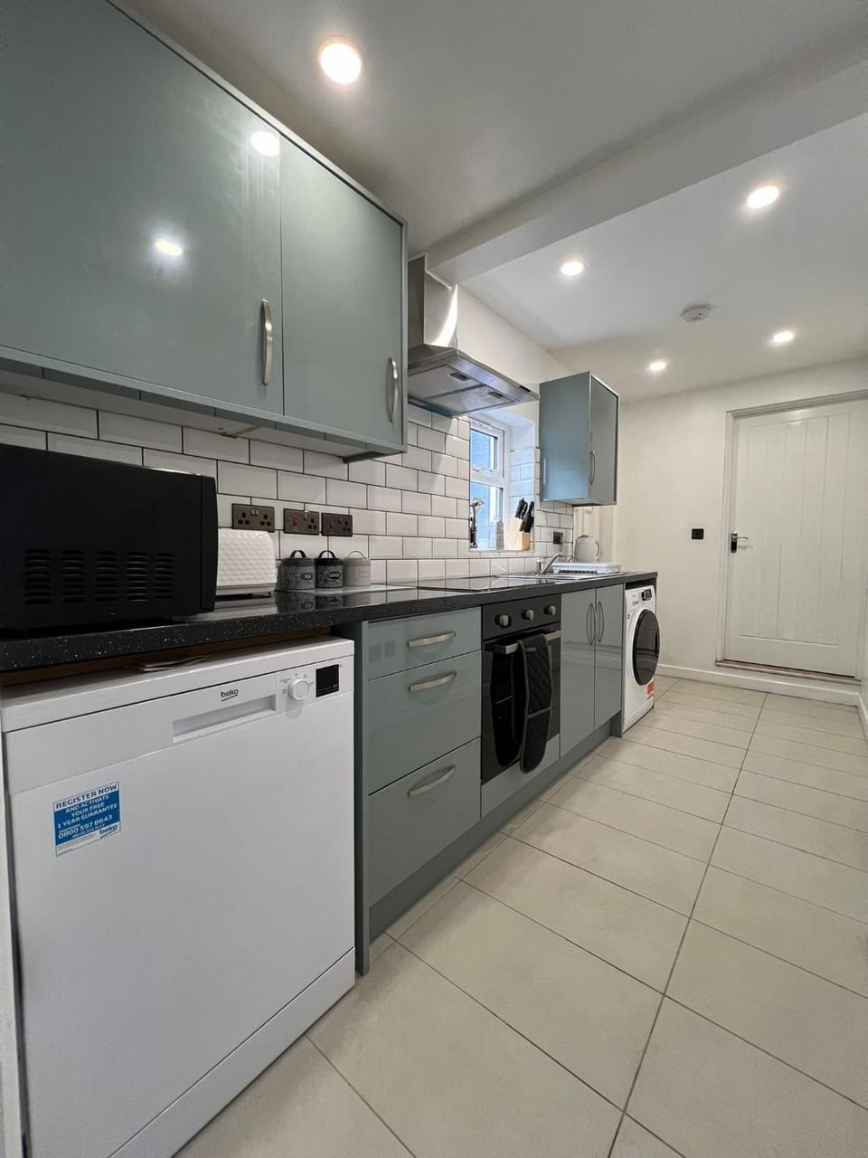 Kitchen or kitchenette, dishwasher, oven, stove, toaster